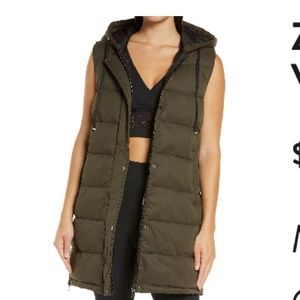Zella long hooded puffer vest in olive kalamata.